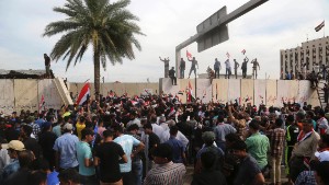 Protesters pull out of Baghdad's Green Zone but vow to be back