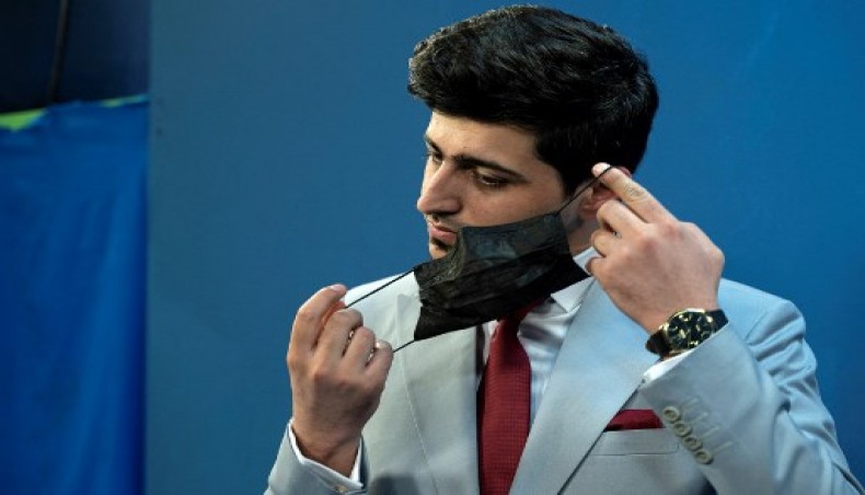 Afghan male TV presenters wear black masks in protest against Taliban