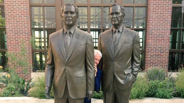 Bill Clinton is literally hiding between two Bushes in a viral photo