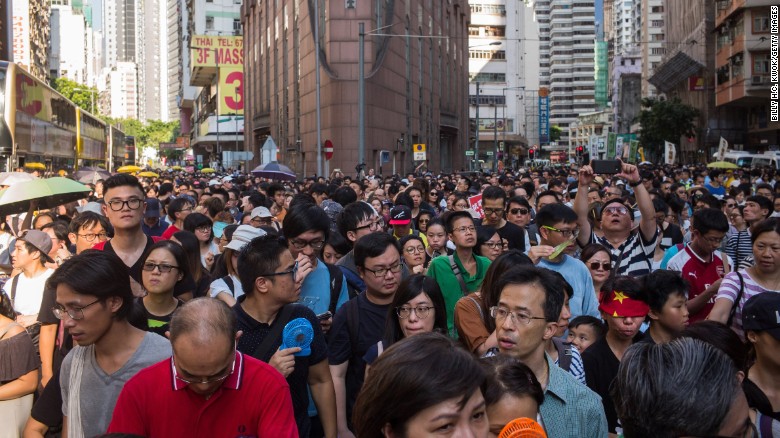 Tens of thousands protest jailing of Hong Kong pro-democracy leaders