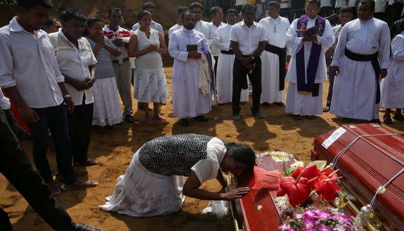 Sri Lankans mourn as death toll rises to 310