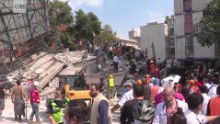 Mexico City crews race to save 3 people trapped in school rubble