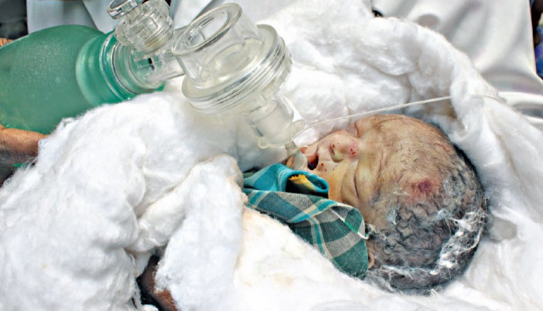  Newborn declared dead moves before burial