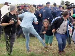 Hungarian camerawoman apologizes for kicking migrants