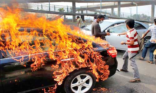 Vehicles torched amid surge in violence.