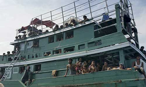  Thai navy tows migrant boat back out to sea