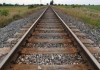 Floods snap rail link in north