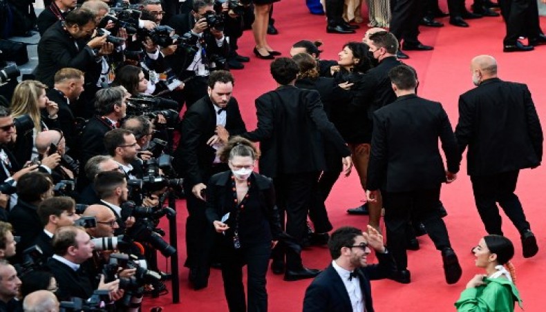 Woman storms Cannes red carpet to protest rapes in Ukraine