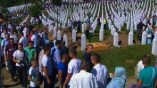 Srebrenica ceremony: Crowd chases Serbian PM as more victims buried