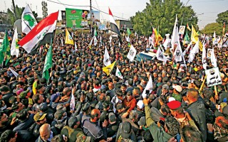 Protests rage as crowds mourn Soleimani