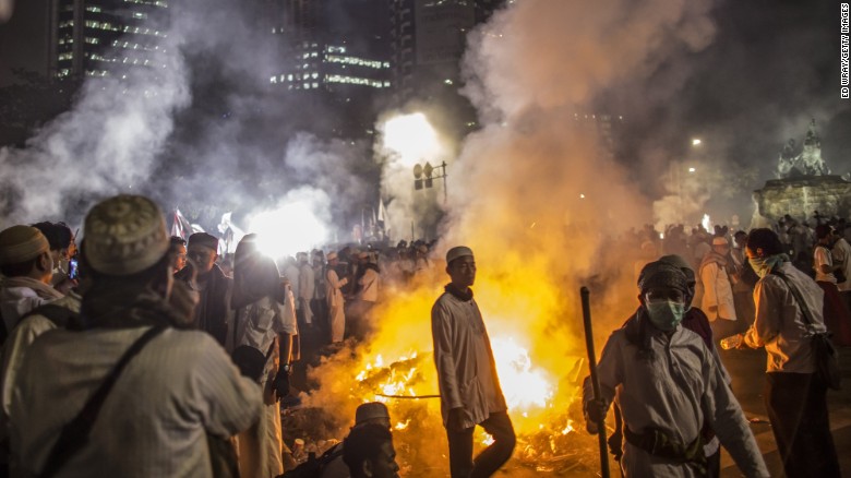 Protesters and police clash in Jakarta over governor's alleged blasphemy