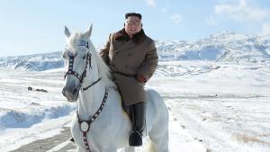 North Korean leader Kim Jong Un rides a white horse on snowy, symbolic mountain